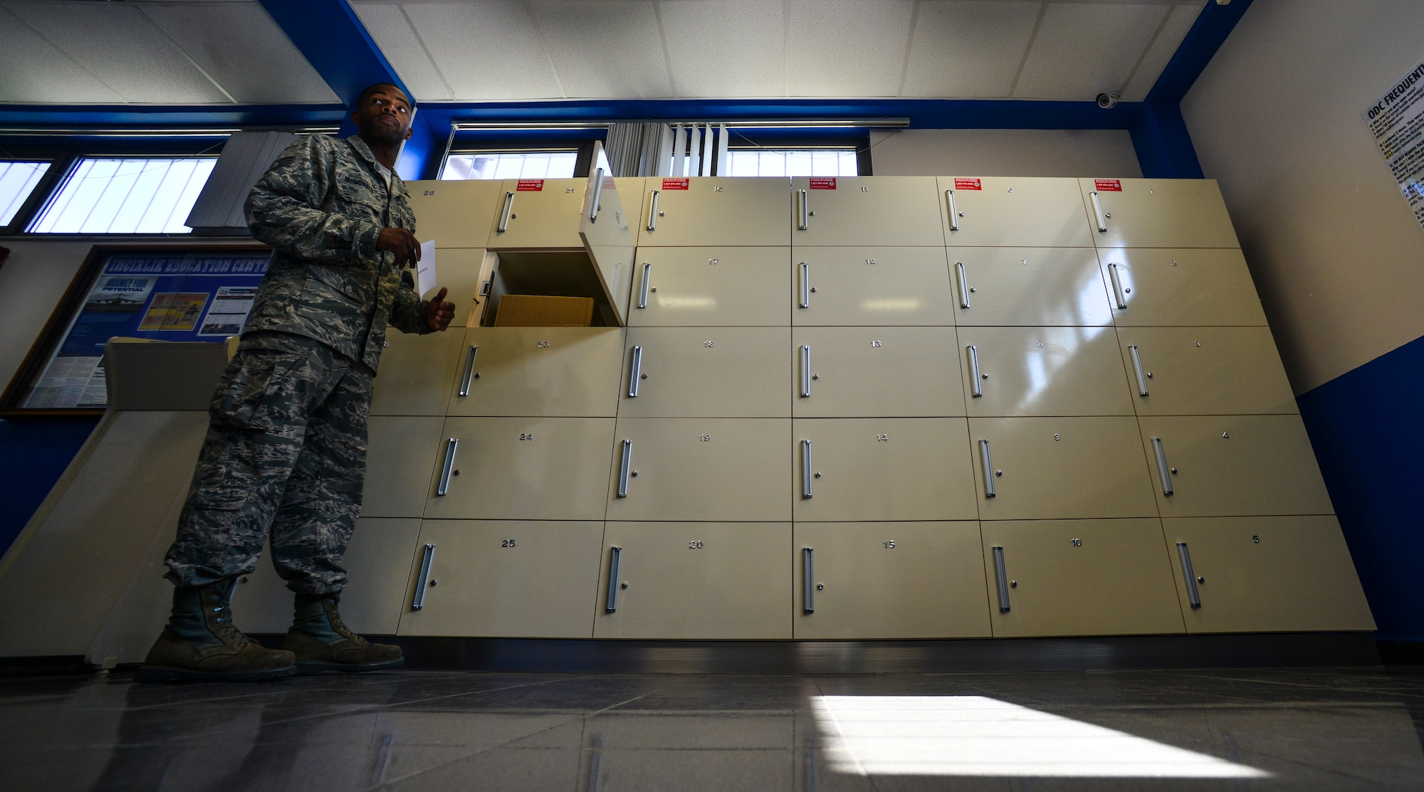 Staff Sgt. Samuel McDonald, 39th Communications Squadron post master, places mail inside of an after-hours parcel pick-up locker Aug. 20, 2014, Incirlik Air Base, Turkey.  For the first time in United States Air Forces in Europe, personnel will be permitted to retrieve ordinary mail at their convenience. (U.S. Air Force photo by Senior Airman Nicole Sikorski/Released) 