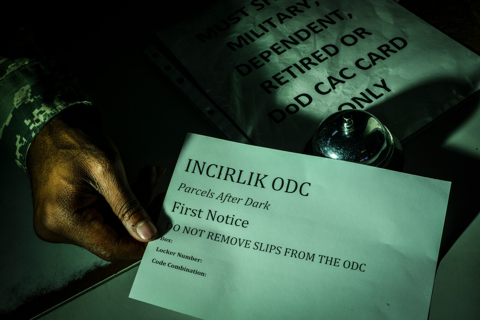 Staff Sgt. Samuel McDonald, 39th Communications Squadron post master, holds an after-hours parcel pick-up slip Aug. 20, 2014, Incirlik Air Base, Turkey.  After hours parcel pick-up will be available to all personnel, but Airmen working outside the customer service window will have first priority. (U.S. Air Force photo by Senior Airman Nicole Sikorski/Released)