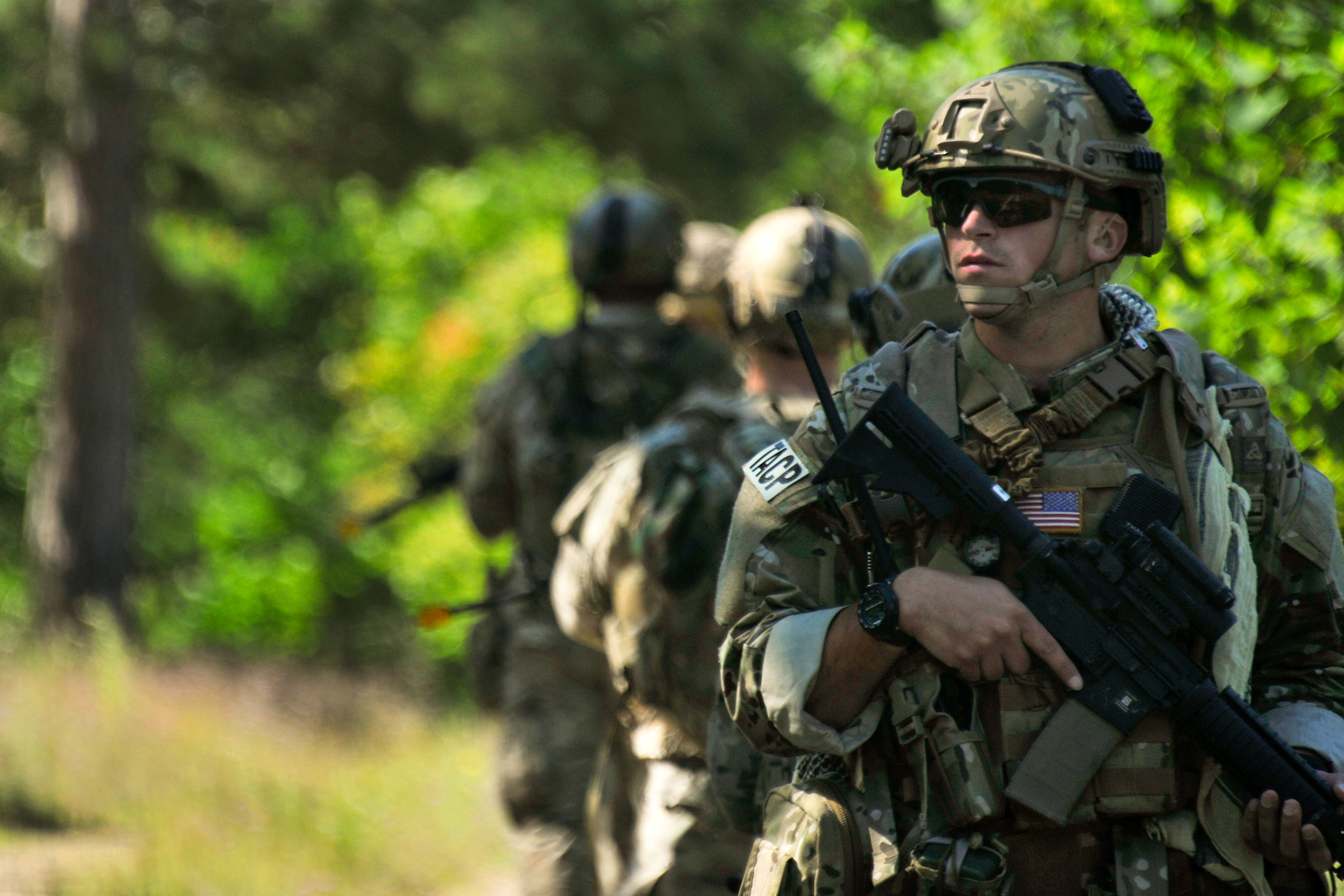 U.S. Air Force Senior Airman Lance A. Liggett covers rear security as ...