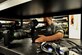 Senior Airman Lee Owens, former 42nd Air Base Wing broadcast engineer, performs a operations inspection on a video camera, July 24, 2014. Owens was one of more than 3,500 Airmen selected for separation after being identified by the Air Force's first Quality Force Review Board. After five years in uniform Owens faces rejoining the civilian sector. (U.S. Air Force photo by Master Sgt. Michael Voss)  