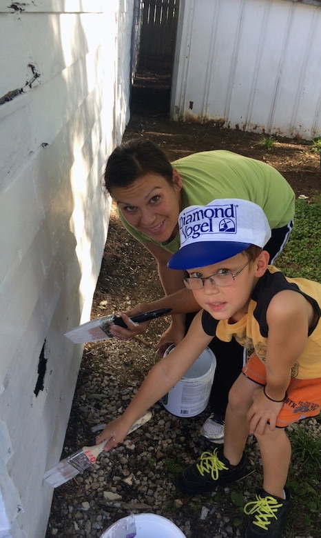 Victoria Duncan, a U.S. Air Force Technical Sergeant, along with her son Ethan, volunteered their time to support the Omaha District Corps of Engineers Paint-A-Thon volunteers.