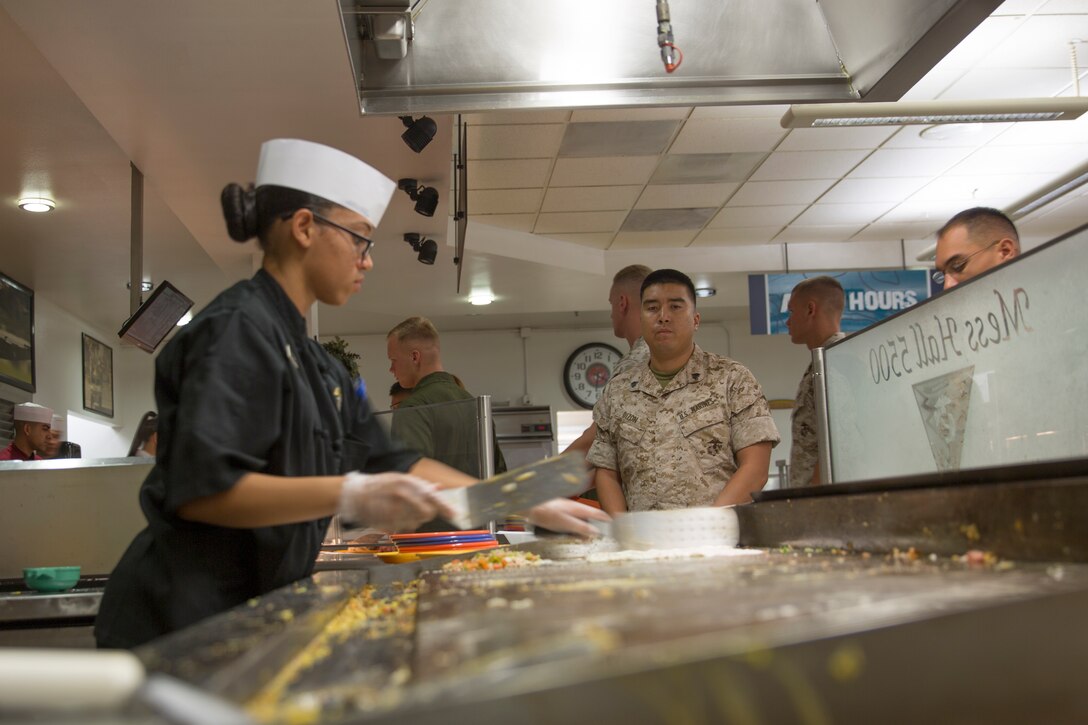 Pfc. Raquel Garcia, a food service technician at Gonzales Hall, cooks an omelet during breakfast before an inspection for the Best of the West competition aboard Marine Corps Air Station Miramar, Calif., Aug. 26. Those inspecting the mess hall judge based on performance, communication, cleanliness, training and sanitation among other factors.