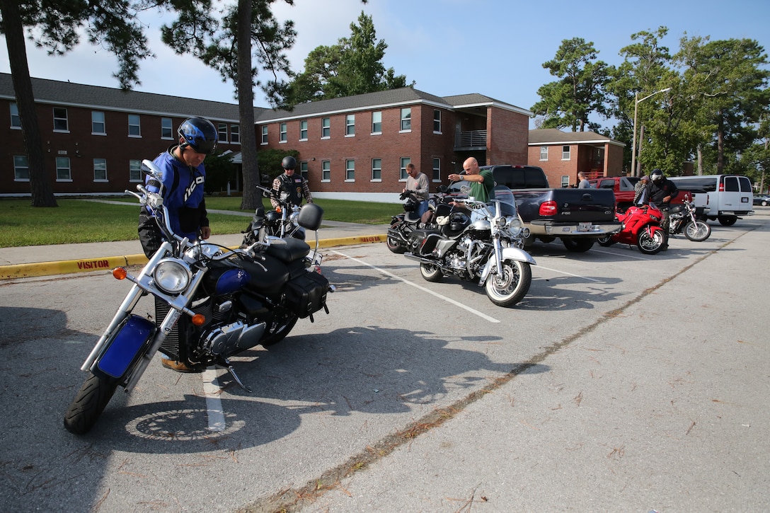Marines with the Ground Combat Element Integrated Task Force conduct pre-ride safety checks on their motorcycles prior to a unit motorcycle ride Aug. 20, 2014, at Marine Corps Base Camp Lejeune, North Carolina. Unit motorcycle group rides are a requirement of the Marine Corps Motorcycle Safety Order and promote safe riding habits across all experience levels.  From October 2014 to July 2015, the GCEITF will conduct individual and collective level skills training in designated ground combat arms occupational specialties in order to facilitate the standards based assessment of the physical performance of Marines in a simulated operating environment performing specific ground combat arms tasks. (U.S. Marine Corps photo by Gunnery Sgt. Matt Epright/Released)