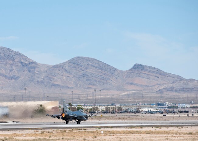 An F-16 Fighting Flacon from the 309th Fighter Squadron, Luke Air Force Base, Ariz., takes off during Green Flag-West 14-10 at Nellis AFB, Nev., Aug. 21, 2014. Green Flag 14-09 has provided the Air Force the opportunity to work with the Army and Navy in integrated combat scenarios. Practicing these integrated scenarios is essential to perfecting communication because real-world combat operations often call for the branches to work together. (U.S. Air Force photo by Airman 1st Class Thomas Spangler)