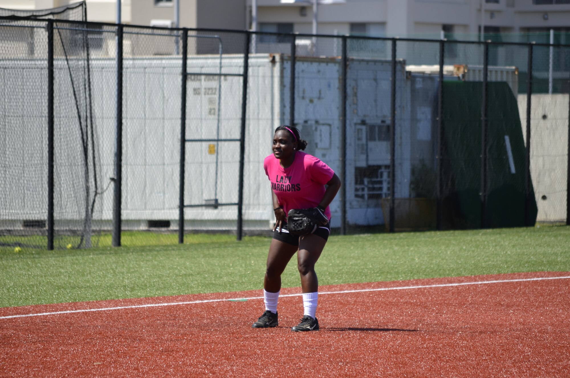 A1C Mychavia Harris, third baseman for the Yokota Lady Warriors, stands ready during a game on Aug. 16, 2014, at Yokosuka Naval Base, Japan. Harris was one of three Airmen chosen to compete for a spot on the All-Air Force Softball team. (U.S. Air Force photo by Tech. Sgt. Gregory Hochgesang/released)