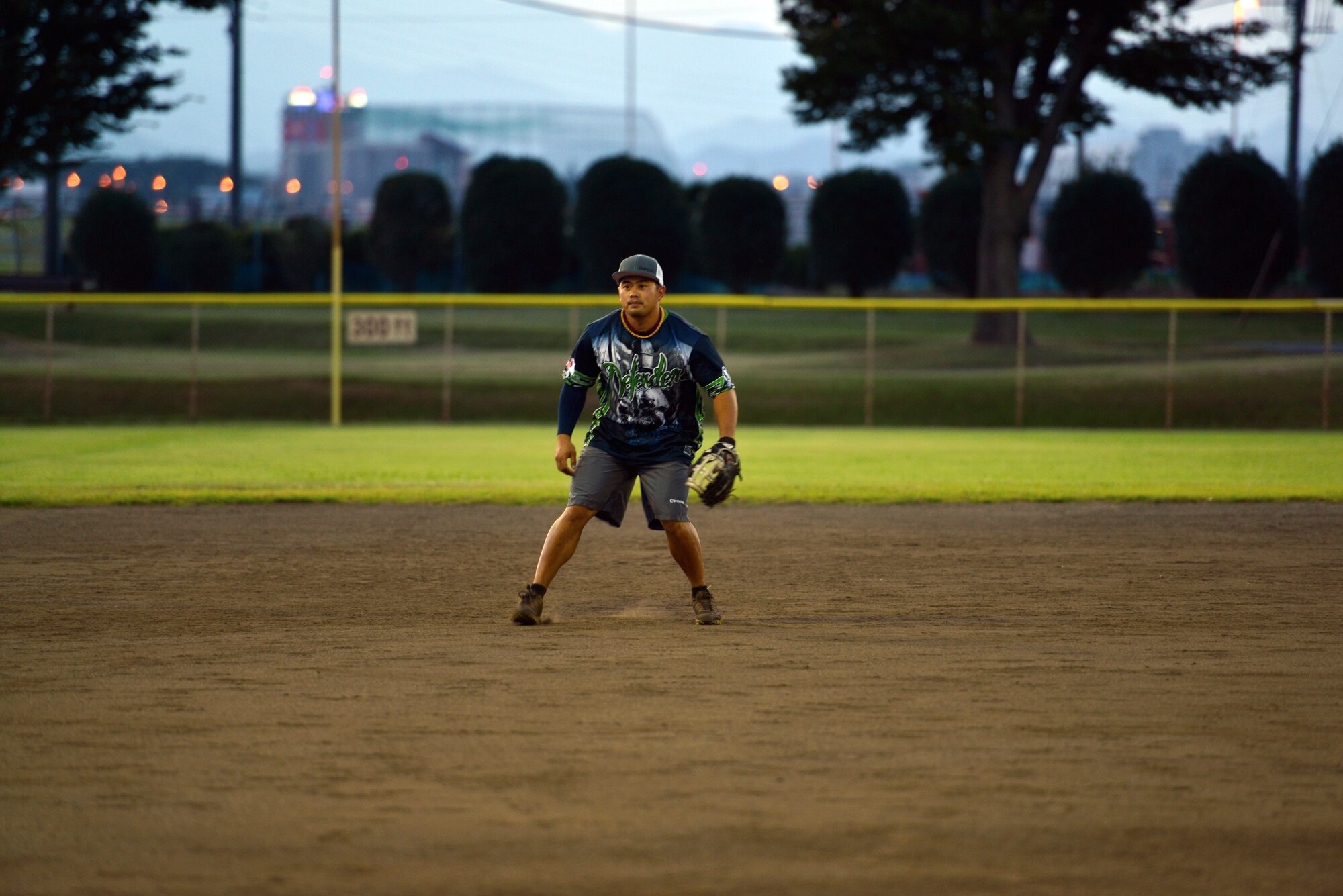 Tech. Sgt. Dale Dominguez, 374th Security Forces Squadron flight chief, prepares to catch a ball while playing third base on the SFS intramural softball team on Aug. 6, 2014, at Yokota Air Base, Japan. Dominguez will compete for a spot on the All-Air Force team at tryout camp Aug. 27 through Sept. 14. (U.S. Air Force photo by Tech. Sgt. Melissa K. Mekpongsatorn/released)