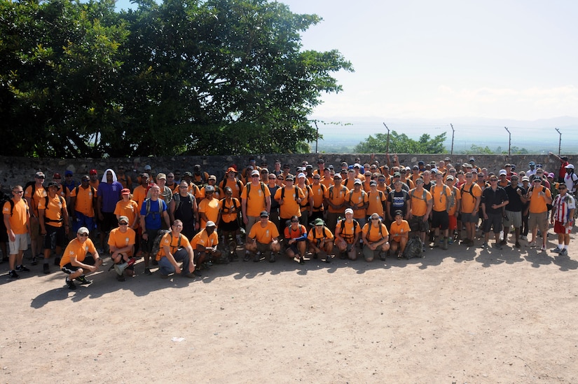 Over 130 members of Joint Task Force-Bravo, with the support of Joint Task Force-Bravo’s Joint Security Forces and Honduran Air Force cadets, hiked nearly eight miles round trip to deliver more than 2,700 pounds of food and supplies to families in need in the mountain village of Soso Mico outside La Paz, Honduras, Aug. 23, 2014.  The effort was part of the 56th Joint Task Force-Bravo Chapel Hike, a venerable tradition during which service members donate their money and time to purchase food and supplies and then tote them on a hike through the mountains to deliver to local, underserviced communities.  (Photo by U.S. Air National Guard Capt. Steven Stubbs)