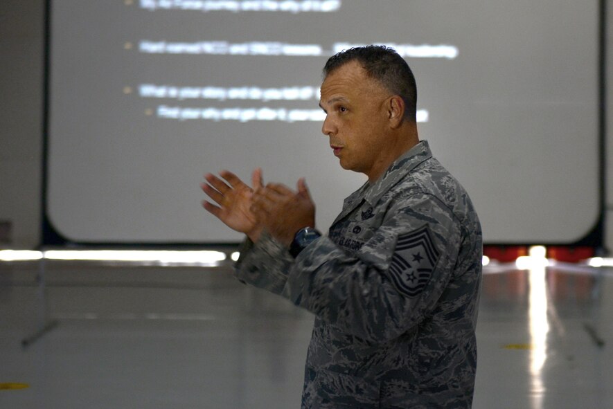 U.S. Air Force Chief Master Sgt. Matthew Caruso, Air Force Special Operations Command command chief, shares his experiences and advice with non-commissioned officers and senior NCOs at an all call Aug. 14, at Cannon Air Force Base, N.M. Travelling around the globe to advise and motivate Air Commandos is part of Caruso’s aim to “give back” to the Air Force.  (U.S. Air Force photo/ Airman 1st Class Shelby Kay-Fantozzi)