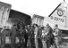 Col. Walter J. Weihe, 131st Wing commander, briefs maintenance Guardsmen and pilots prior to leaving for a training mission at Volk Field, Wisconsin. Utilizing the Gooney Bird’s versatility and 28-man capacity, the Missouri Air Guard often transported Missouri Guardsmen to their training sites across the country. Circa 1961, Lambert-Saint Louis Air National Guard Base. (131st Bomb Wing File photo/RELEASED).