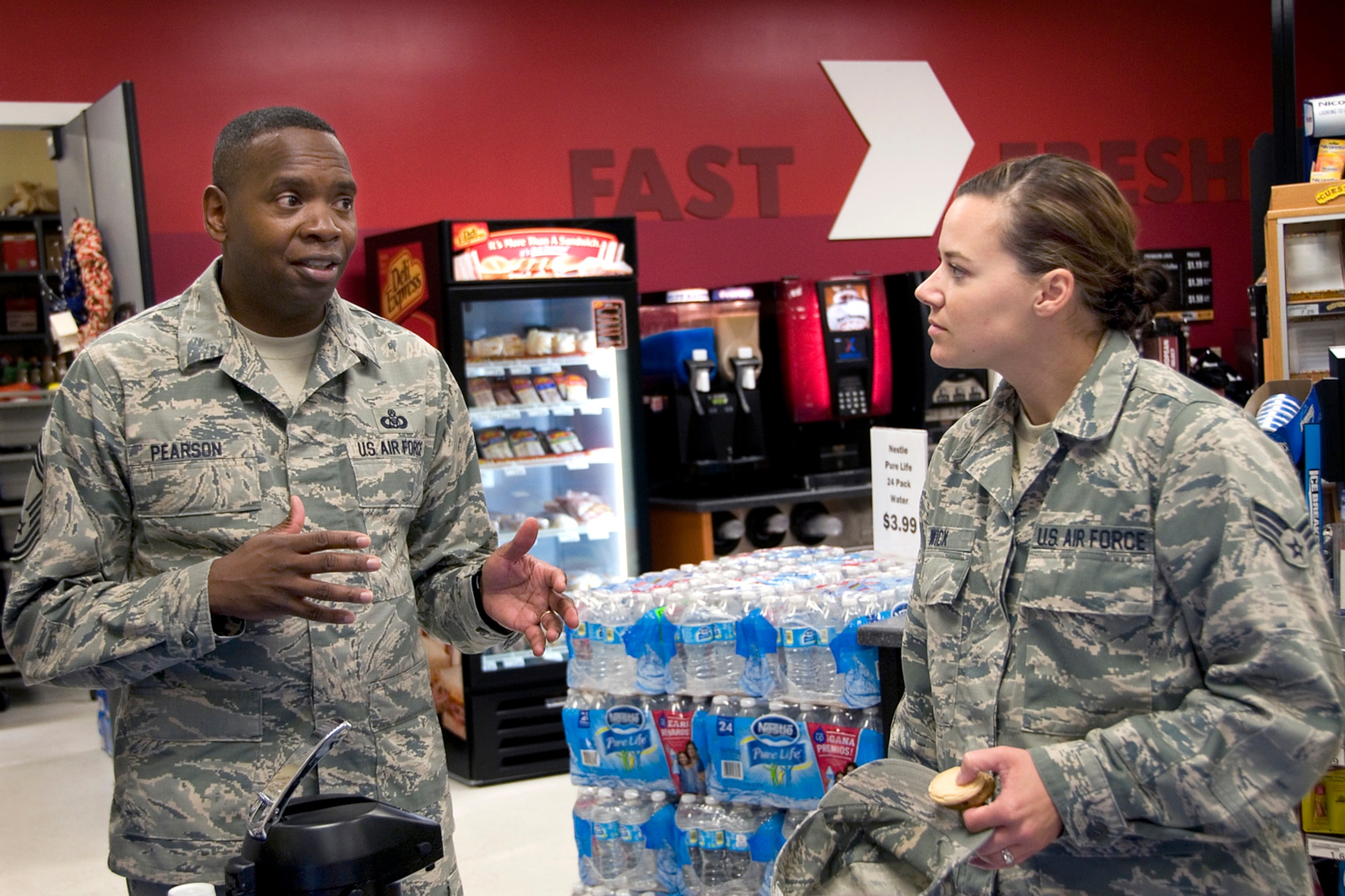 Chief Master Sgt. Anthony Pearson, Army and Air Force Exchange Service senior enlisted advisor, speaks with Senior Airmen Brittany Wick, 434th Operations Support Squadron aircrew flight equipment apprentice, during the chief's visit to Grissom Air Reserve Base, Ind., Aug. 12, 2014. During Pearson's visit he met with service and community members to addressed AAFES related issues and inform customers of the benefits of shopping at an Exchange. (U.S. Air Force photo/Staff Sgt. Ben Mota)