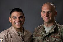 Master Sgt. Justin Speight and Senior Airman Timothy Kantorak, 757th Airlift Squadron loadmasters deployed with the 737th Expeditionary Airlift Squadron in Southwest Asia, pose for a photo after conducting phone interviews with several Ohio news agencies. The Airmen participated in humanitarian cargo airdrops to stranded Iraqi refugees on Mount Sinjar in Norther Iraq, Aug. 8-14. (U.S. Air Force photo by Staff Sgt. Jeremy Bowcock)