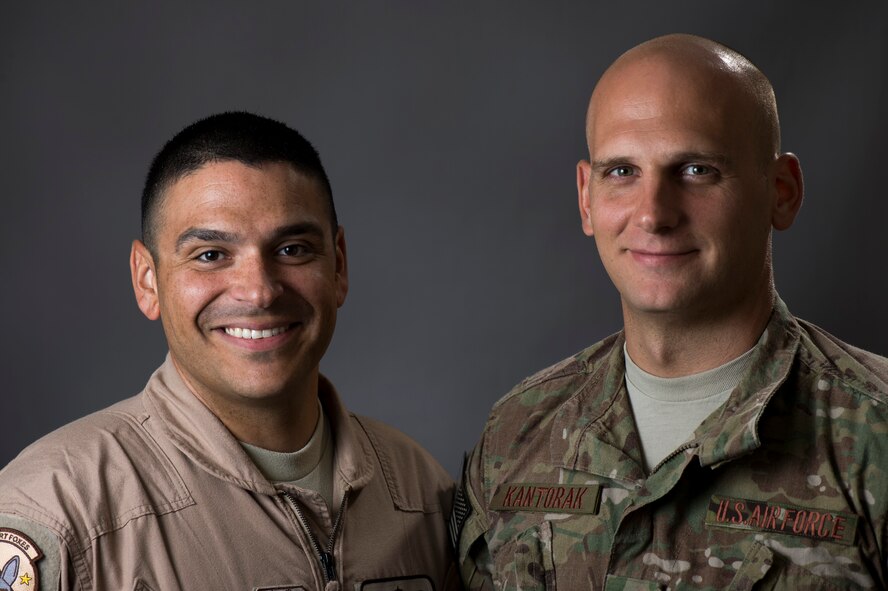 Master Sgt. Justin Speight and Senior Airman Timothy Kantorak, 757th Airlift Squadron loadmasters deployed with the 737th Expeditionary Airlift Squadron in Southwest Asia, pose for a photo after conducting phone interviews with several Ohio news agencies. The Airmen participated in humanitarian cargo airdrops to stranded Iraqi refugees on Mount Sinjar in Norther Iraq, Aug. 8-14. (U.S. Air Force photo by Staff Sgt. Jeremy Bowcock)