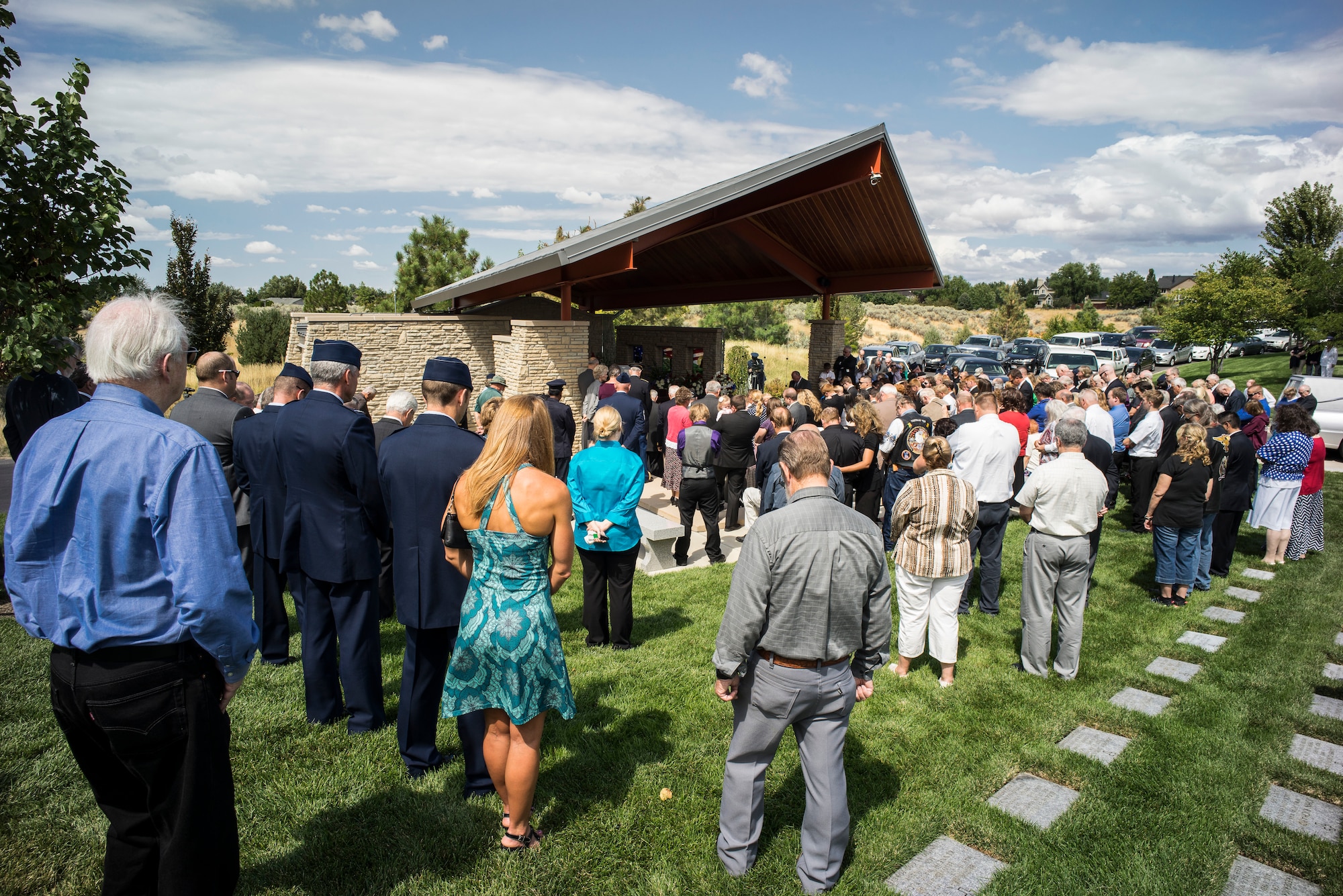 Family and friends gather during the interment ceremony for Col. (Ret.) Bernard Fisher at the Idaho State Veterans Cemetery August 25, 2014, in Boise, Idaho. He was presented the Congressional Medal of Honor for risking his life going above and beyond the call of duty to save a fellow pilot who had been shot down at A Shau Air Base during the battle of A Shau Valley, March 10, 1966. (U.S. Air Force photo by Tech. Sgt. Samuel Morse/RELEASED)