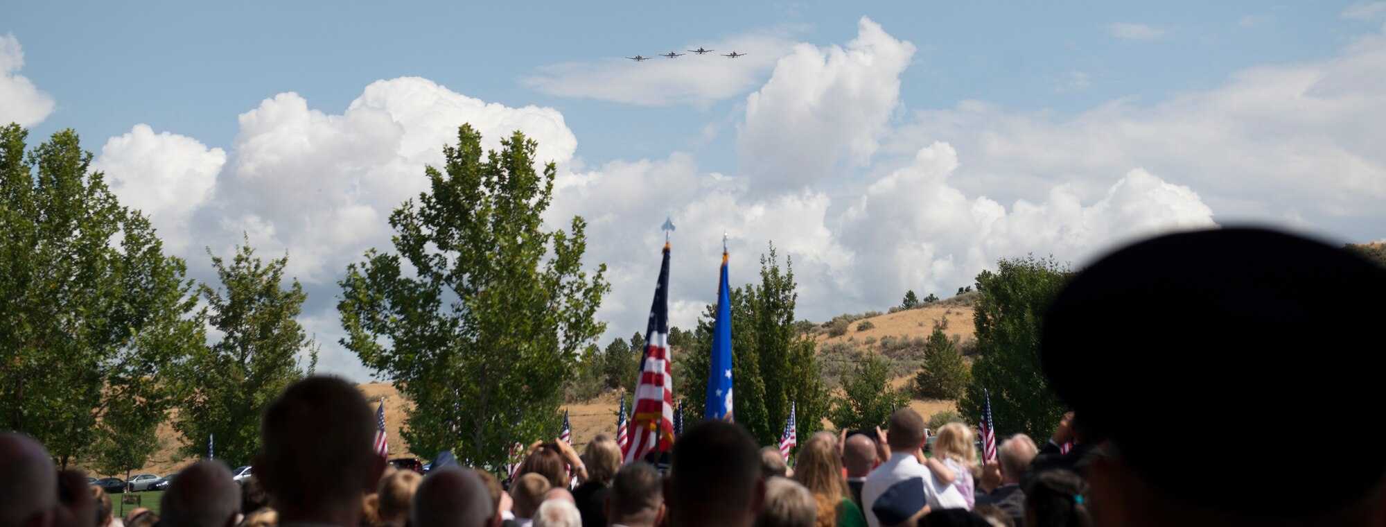 A flight of A-10s conducted a fly over for the late Col. (Ret.) Bernard Fisher, a Medal of Honor recipient at Idaho State Veterans Cemetery August 25, 2014, at Boise, Idaho. Fisher arrived at the 124th Fighter Interceptor Group (ANG), in Boise in July 1971 and retired from this assignment July 30, 1974, making Kuna his permanent home. (U.S. Air Force photo by Airman 1st Class Malissa Lott/RELEASED)