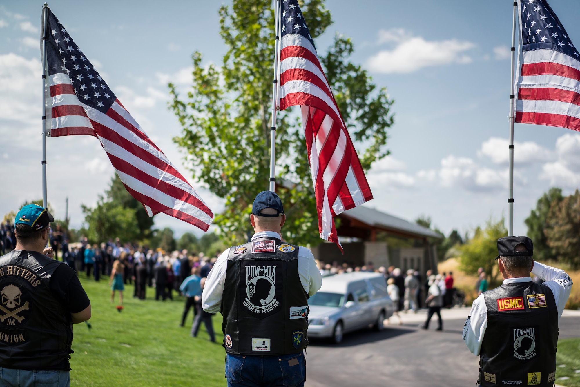 Patriot Guard members honor the late Col. (Ret.) Bernard Fisher, a Medal of Honor recipient at Idaho State Veterans Cemetery August 25, 2014, at Boise, Idaho. Fisher, who was born in San Bernadino, Calif., on January 11, 1927, grew up in Clearfield, Utah, and first called Kuna, Idaho, home after his discharge from the U.S. Navy V-6 program in 1946. (U.S. Air Force photo by Tech. Sgt. Samuel Morse/RELEASED) 