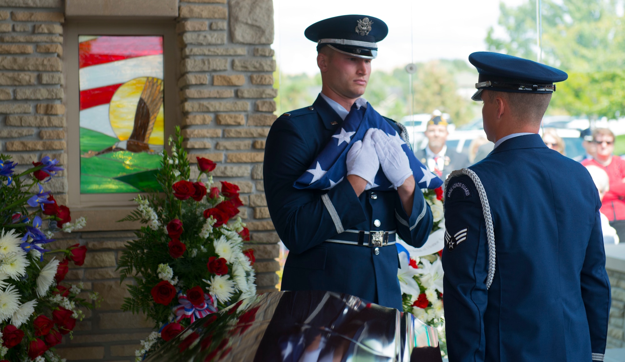 Mountain Home Air Force Base Honor Guard presented the folded flag at the internment of Col. (Ret.) Bernard Fisher at Idaho State Veterans Cemetery August 25, 2014, at Boise, Idaho. Fisher arrived at the 124th Fighter Interceptor Group (ANG), in Boise in July 1971 and retired from this assignment July 30, 1974, making Kuna his permanent home. (U.S. Air Force photo by Airman 1st Class Malissa Lott/RELEASED)