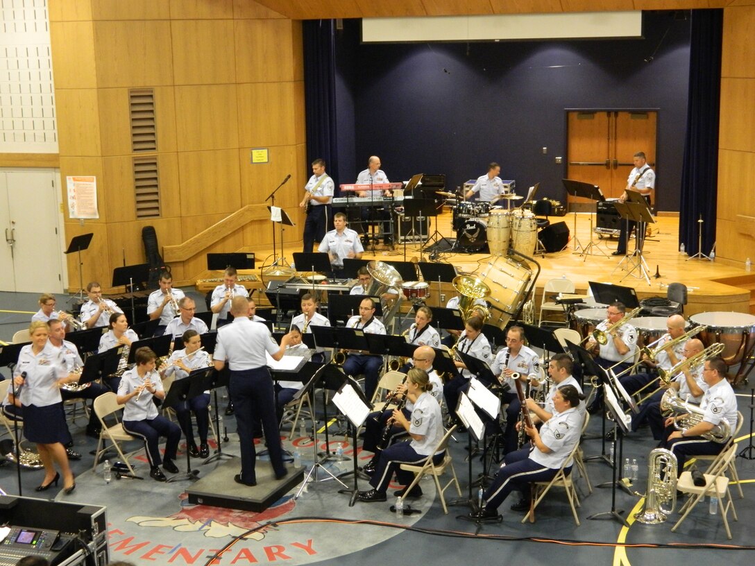 The Air National Guard Band of the Northeast, led by Senior Master Sergeant Donald Naumann, performs at the East Brookfield, MA Elementary School on July 3, 2014. (U.S. Air Force Photo/Technical Sgt. Dawn Hoffman)