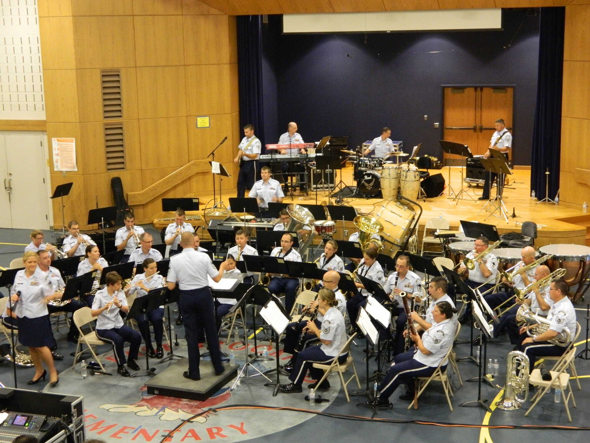 The Air National Guard Band of the Northeast, led by Senior Master Sergeant Donald Naumann, performs at the East Brookfield, MA Elementary School on July 3, 2014. (U.S. Air Force Photo/Technical Sgt. Dawn Hoffman)