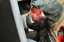 Tech. Sgt. Kevin McPherson, 91st Operations Group superintendent of missile alert facility management, performs daily checks at a missile alert facility in North Dakota. FMs are responsible for the day-to-day operations at a MAF and ensure the Airmen are taken care of at their home away from home. (U.S. Air Force photo/Senior Airman Brittany Y. Bateman)
