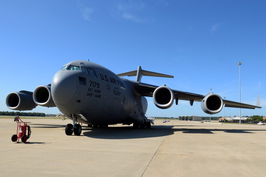 A U.S. Air Force C-17 Globemaster III assigned to Travis Air Force Base, C.A., is parked on the Shaw AFB, S.C., flightline during a routine stop while in route to Aviano Air Base, Italy, Aug. 26, 2014. The C-17 is powered by four, fully reversible, Federal Aviation Administration-certified F117-PW-100 engines. The C-17 made its maiden flight on Sept. 15, 1991, and the first production model was delivered to Joint Base Charleston, S.C., on June 14, 1993. (U.S. Air Force photo by Airman 1st Class Jonathan Bass/Released)