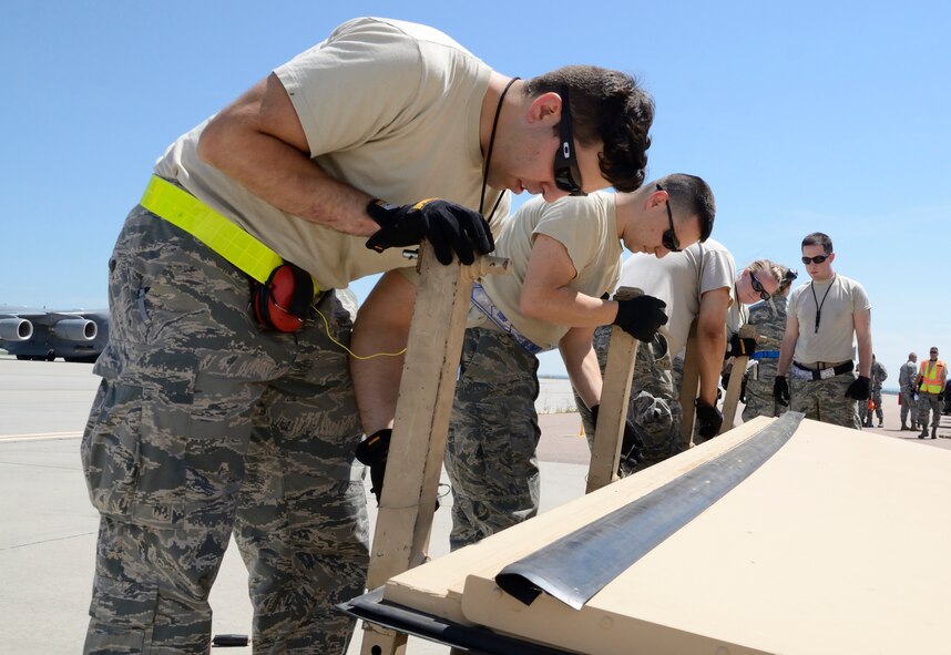 Forty-Seven Westover, Joint Base Charleston and March ARB Airmen came together to work hand-in-hand during "Patriot Express," a periodic Air Force Reserve Command air mobility exercise that took place in the heat of the summer in Colorado, Aug. 13-18. (U.S. Air Force photo/SrA. Alexander Brown)