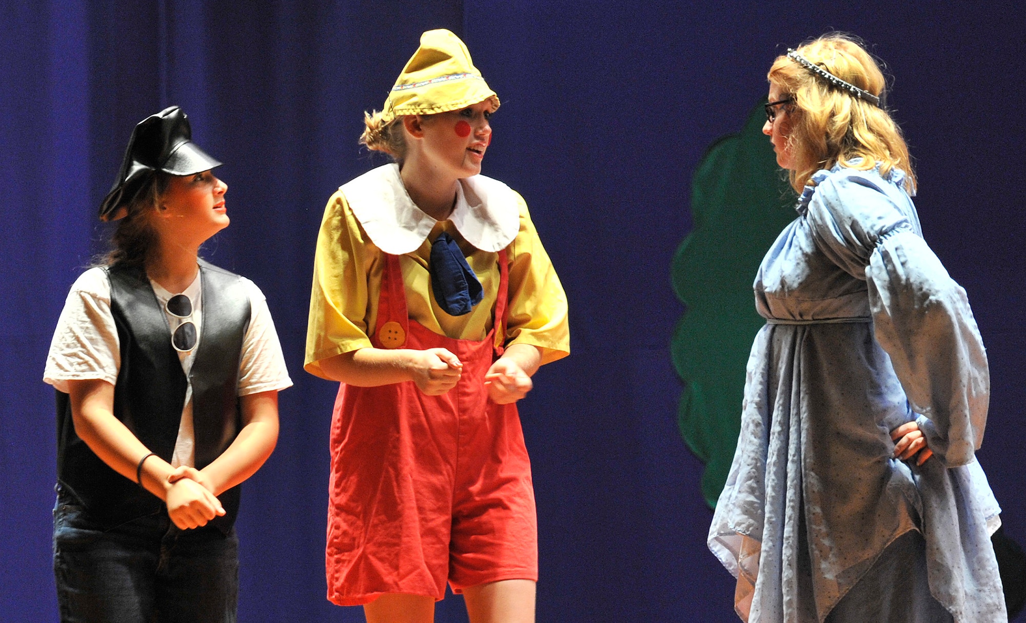 Candlewick (Madison Wilson, left) and Pinocchio (Faith Quinlisk) decide to leave school and live on Pleasure Isle despite warnings from the Blue Fairy (J.J. Slater, right). The play “PINOCCHIO” ran Aug. 22 at the Malmstrom Air Force Base auditorium, and was presented by the 341st Force Support Squadron’s Youth Programs and the Missoula Children’s Theatre. (U.S. Air Force photo/John Turner)