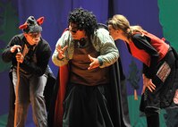Evil puppeteer Stromboli (Blaire Smith, center) enlists the help of Fox (Kaia Nelson) and Cat (Kaitlyn Bratten) to capture Pinocchio in the forest. The play “PINOCCHIO” ran Aug. 22 at the Malmstrom Air Force Base auditorium, and was presented by the 341st Force Support Squadron’s Youth Programs and the Missoula Children’s Theatre. (U.S. Air Force photo/John Turner)