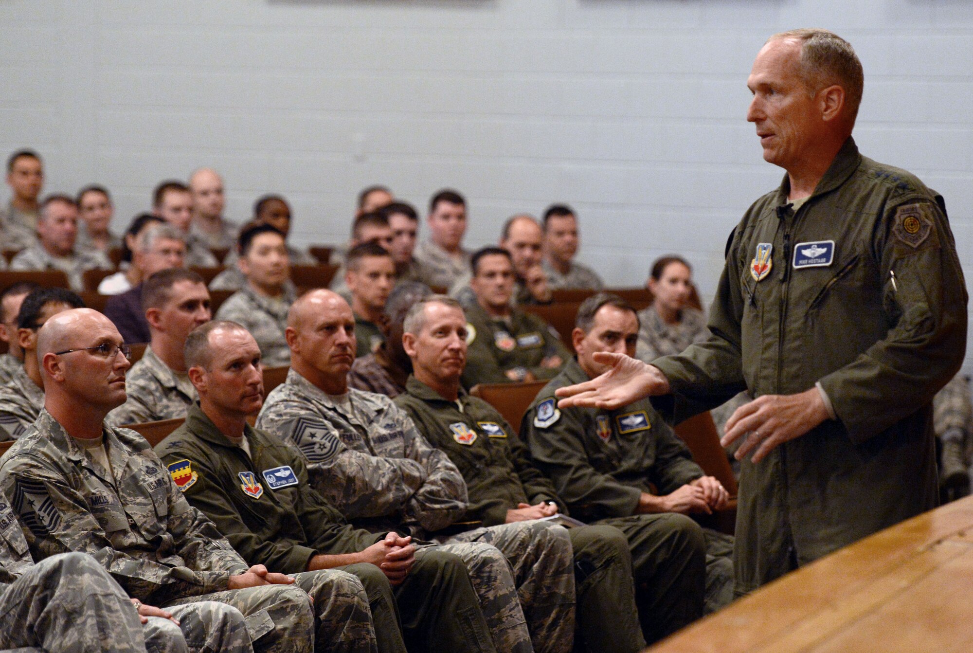 U.S. Air Force Gen. Mike Hostage, commander of Air Combat Command, speaks with members of Team Shaw during an all-call at Shaw Air Force Base, S.C., Aug. 20, 2014. During the all-call Hostage discussed the top issues on Airmen’s minds. (U.S. Air Force photo by Senior Airman Tabatha Zarrella/Released)