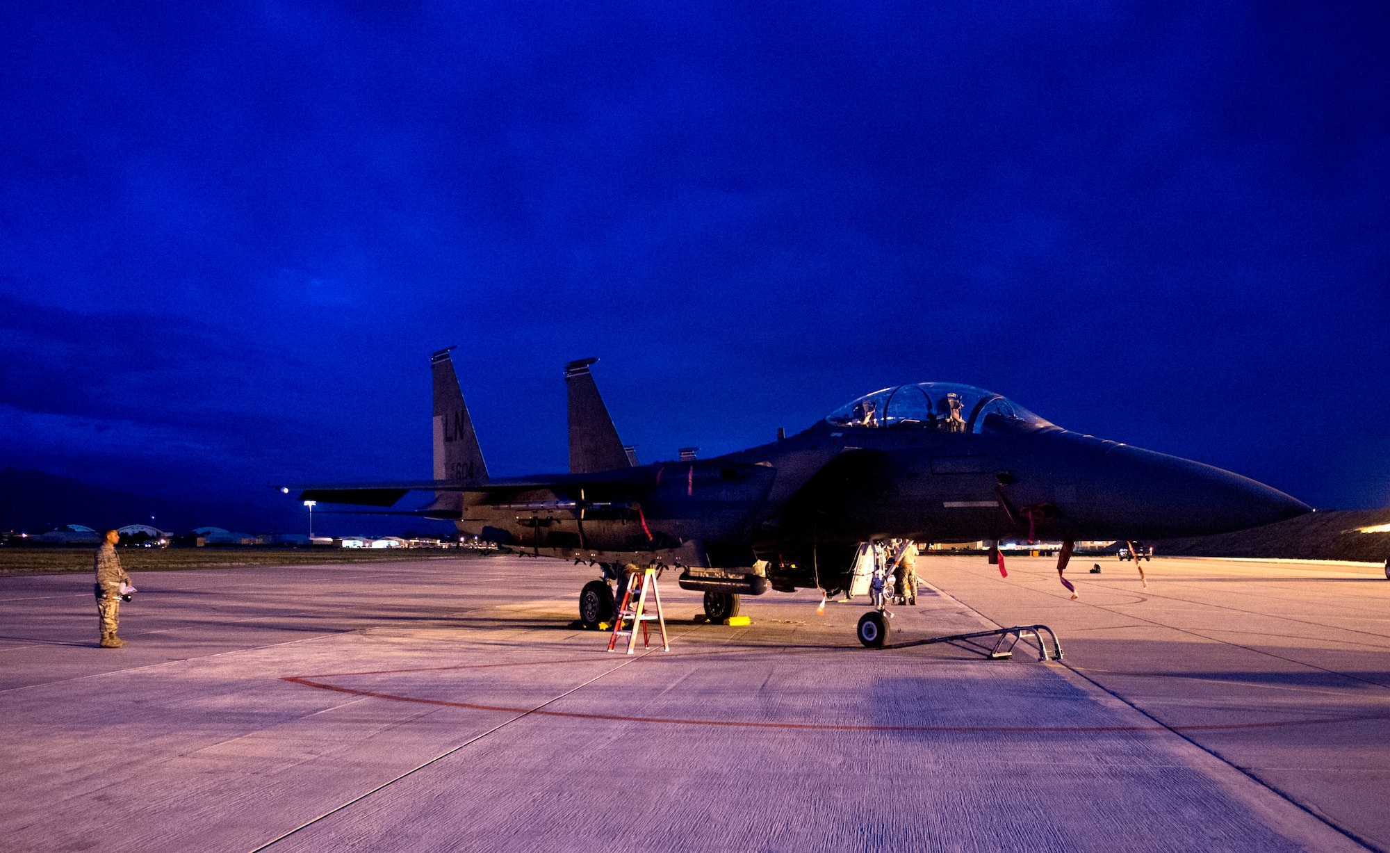 An F-15 Eagle from Royal Air Force Lakenheath, England awaits munitions for a flight later in the day on Hill Air Force Base, Utah, Aug. 20, 2014. The F-15 is from Royal Air Force Lakenheath, England, and was on Hill AFB as part of a Weapon System Evaluation Program in conjunction with F-16 Fighting Falcons from Aviano Air Base, Italy. (U.S. Air Force photo by Airman 1st Class Joshua King/Released)