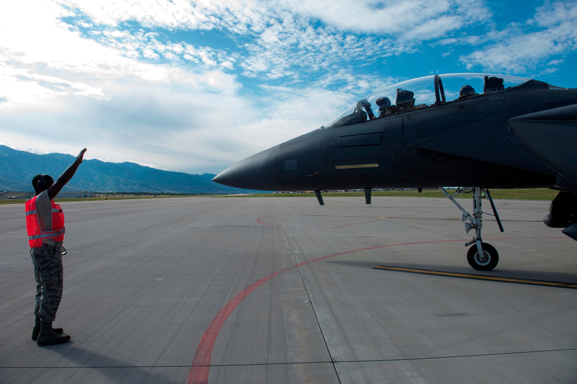 An F-15 Eagle from Royal Air Force, Lakenheath, England, receives a final pre-flight check before taking off from Hill Air Force Base, Utah, Aug. 20, 2014. F-15s from RAF Lakenheath and F-16s from Aviano Air Base, Italy, were at Hill AFB for a Weapon System Evaluation Program. (U.S. Air Force photo by Airman 1st Class Joshua King/ Released)