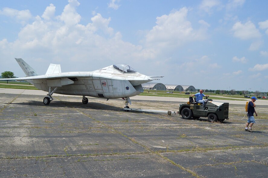 DAYTON, Ohio -- Restoration specialists Roger Brigner (driving) and Duane Jones move the Boeing X-32A into a storage facility at the National Museum of the U.S. Air Force. (U.S. Air Force photo by Ken LaRock)