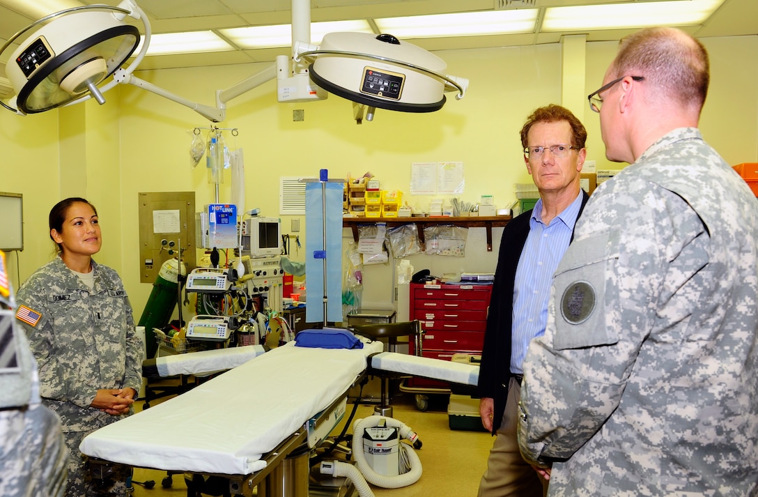 Ambassador James Nealon discusses the Medical Element's on-base and expeditionary medical capabilities during his first visit to Soto Cano Air Base, Honduras Aug. 25, 2014.  Ambassador Nealon recently arrived in Honduras Aug. 13, 2014 as the new U.S. Ambassador to the Republic of Honduras and most recently served as the Civilian Deputy to the Commander of U.S. Southern Command from Sept. 2013 to Aug. 2014.  (Photo by Martin Chahin)