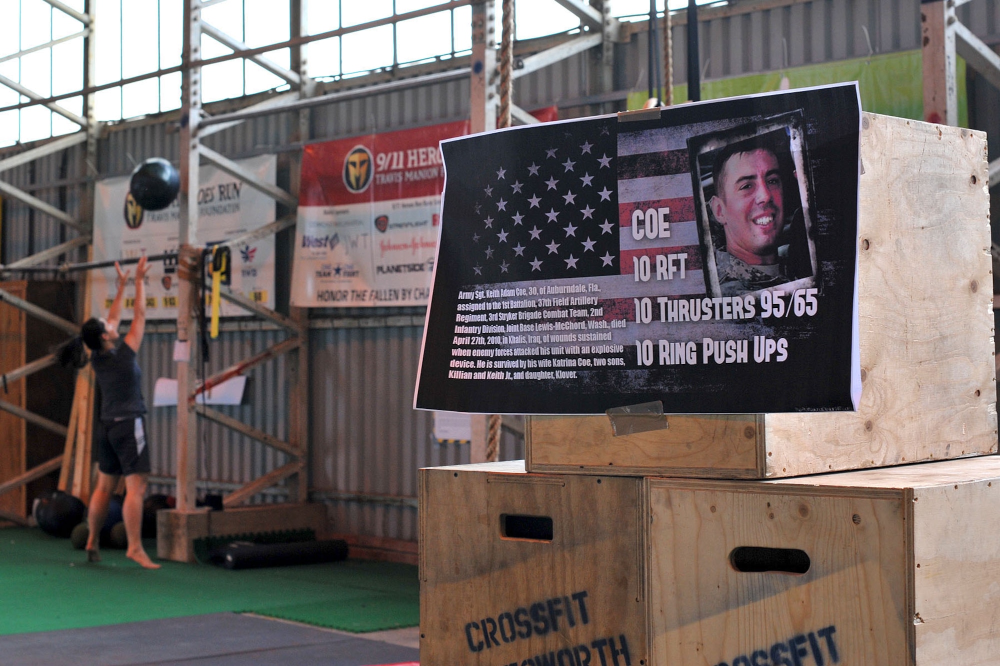 A member of CrossFit Molesworth does a warm-up before the start of the Coe Hero workout of the day at RAF Molesworth, United Kingdom, Aug. 14, 2014. The Coe Hero WOD was held to honor U.S. Army Sgt. Keith Adam Coe, who was assigned to the 1st Battalion, 37th Field Artillery Regiment, 3rd Stryker Brigade Combat Team, 2nd Infantry Division, Joint Base Lewis-McChord, Wash., when he died April 27th, 2010 in Khalis, Iraq of wounds sustained from an explosive device set off by enemy forces. (U.S. Air Force photo by Staff Sgt. Ashley Hawkins/Released) 