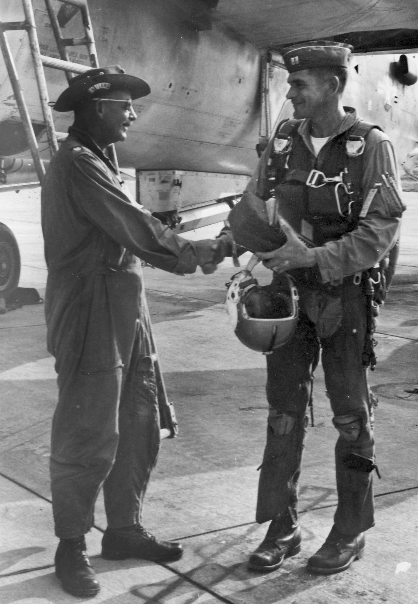 On Jan. 23 1966, then-Capt. Stan Lockley receives a hand shake after completing 100 combat missions over North Vietnam.  The retired colonel visited the Air Force Armament Museum Aug. 26 to see his old friend, the F-105 Thunderchief, located inside the museum.   The 86-year-old Lockley is a former vice commander of both the 33rd (Tactical) Fighter Wing and the 96th Test Wing and was one of the first Air Force pilots to complete 100 combat missions over North Vietnam.  (Courtesy photo)
