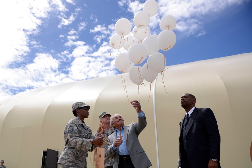 David Bram, a Holocaust survivor, releases balloons as a symbol of remembrance during the Holocaust Remembrance Day Aug. 20, 2014, at Schriever Air Force Base, Colo. Bram was invited as a guest speaker for the day to share his story about the atrocities he experienced firsthand. (U.S. Air Force Photo/Christopher DeWitt) 
