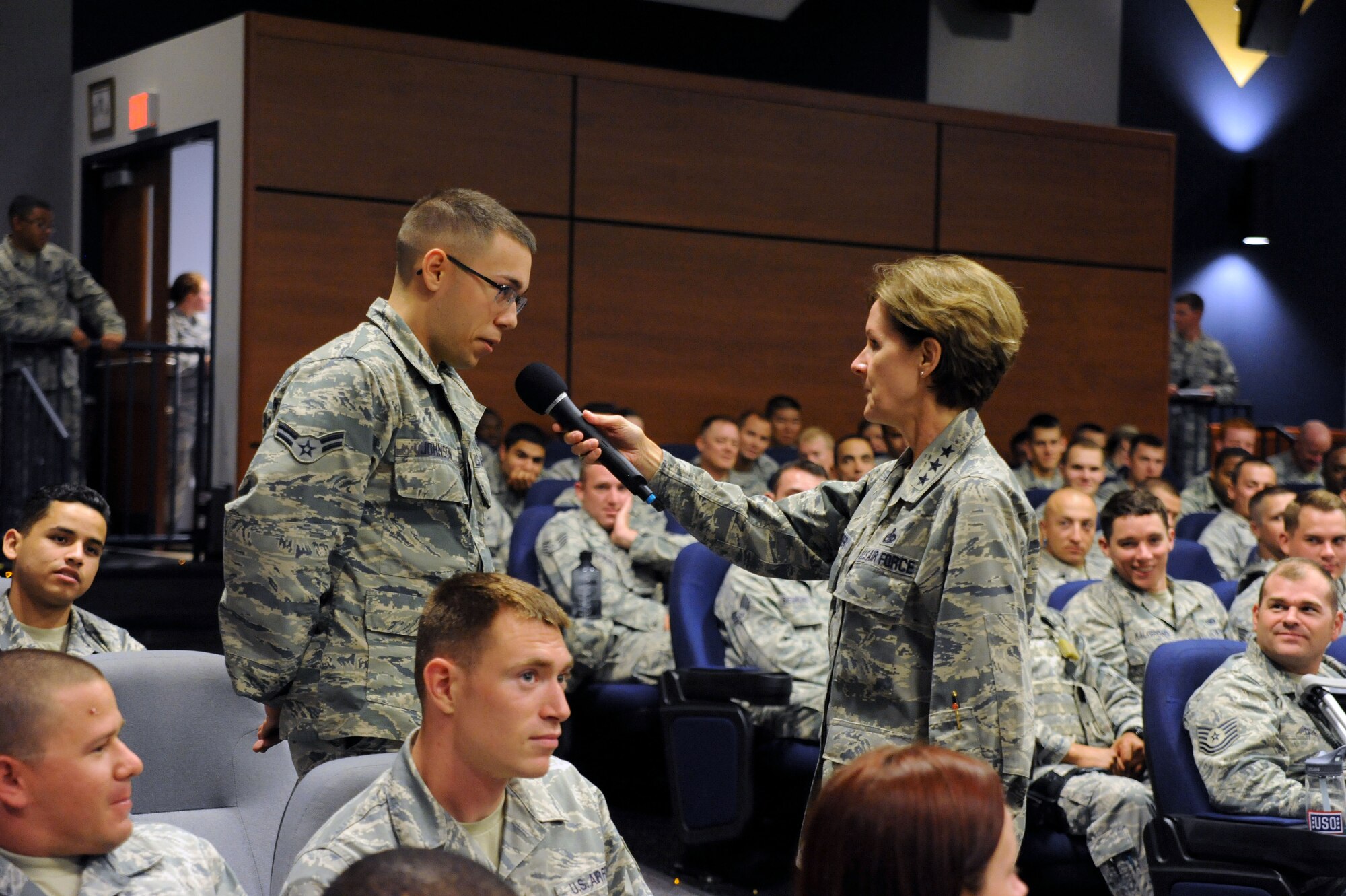 Air Force Lt. Gen. Judith A. Fedder, Deputy Chief of Staff for Logistics, Headquarters U.S. Air Force, talks to Airman 1st Class Zackary Johnson, 817th Global Mobility Squadron, during an all-call held at Joint Base McGuire-Dix-Lakehurst, N.J., Aug. 19, 2014. During their discussion, Fedder said she hoped the legacy that the older generation left behind would be picked up by Johnson and others in the newest generation of Airmen and carried on for the next 20 years. (U.S. Air Force photo by Danielle Brooks/Released)