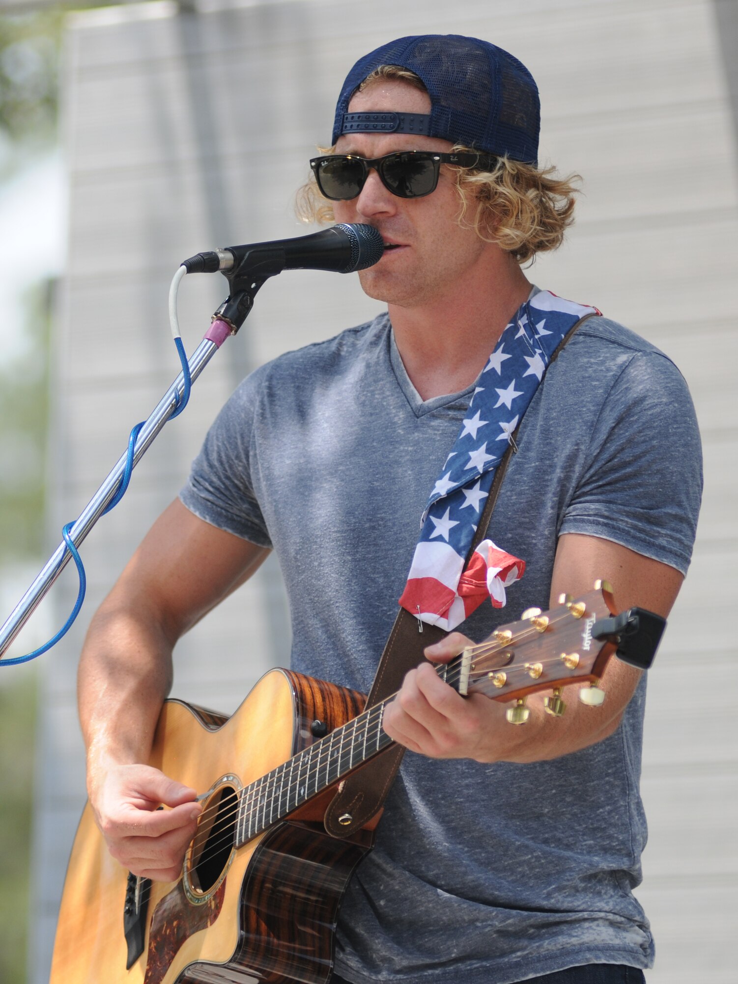 Derek Norsworthy performs with his band during the BBQ on the Bay event Aug. 23, 2014, at the Marina Park, Keesler Air Force Base, Miss.  BBQ plates were sold and a Mullet toss competition also took place.  (U.S. Air Force photo by Kemberly Groue)