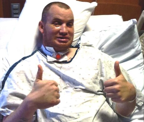 Staff Sgt. Bobby Pantfoeder, Ellsworth Honor Guard NCO in charge, gives a thumbs up while recovering from surgery on May 26, 2014. Despite all the injuries he sustained from the motorcycle crash, Pantfoeder plans to continue to ride once all repairs are made. (Courtesy photo)