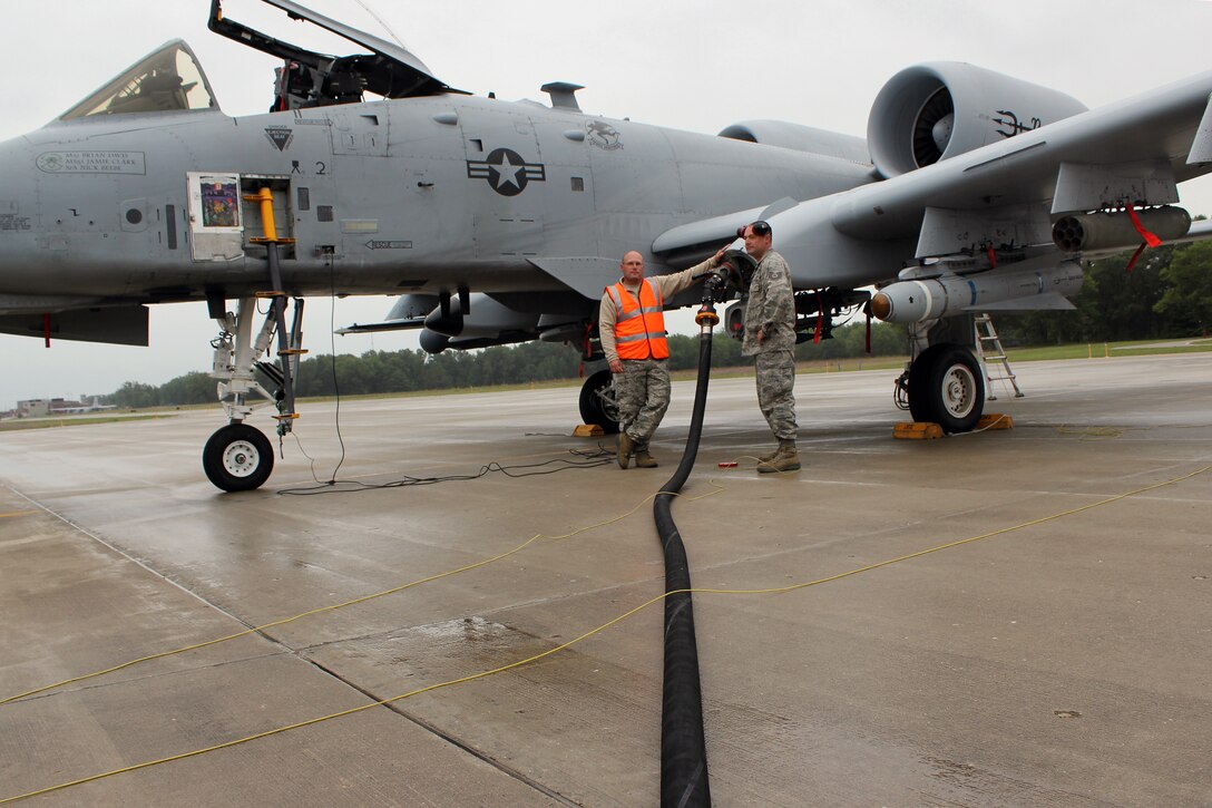 Airmen from the 174th Attack Wing, New York Air National Guard, refuel an A-10 Thunderbolt II during Operation Northern Strike at the Alpena Combat Readiness Training Center, Aug. 16, 2014. The A-10 is from the 127th Wing, Michigan Air National Guard. Twenty-four units from 12 states and two coalition partners will participate in the three-week event. Operation Northern Strike will occur from Aug. 4 - 22, 2014, at the Alpena Combat Readiness Training Center and Camp Grayling Joint Maneuver Training Center. Over 300 Total Force fighter, bomber, mobility, and rotary sorties are planned in support of live fire exercises in order to meet stated objectives for participating units. (U.S. Air National Guard photo by Tech. Sgt. Dan Heaton)

