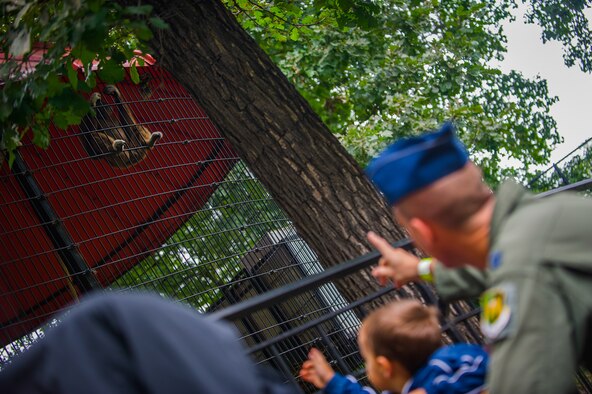 Capt. Tyler N. Hanrion, 23rd Bomb Squadron, and his son view a monkey exhibit at Roosevelt Park Zoo in Minot N.D. Friday, Aug. 22. Military Appreciation Day at the zoo offered free food and admission for service members and their families. (U.S. Air Force photo/1st Lt. Jose R. Davis)