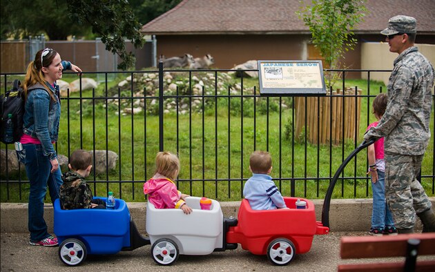 Senior Airmen Adam Rivers, 5th Civil Engineer Squadron, and his family enjoy their outing at Roosevelt Park Zoo Friday in Minot, N.D., Aug. 22. Military Appreciation Day at the zoo offered free food and admission for service members and their families. (U.S. Air Force photo/1st Lt. Jose R. Davis)