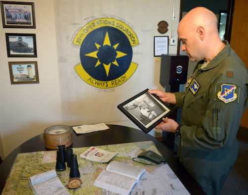 Maj. Ryan Williams, 39th Operations Support Squadron, director of operations, shows history pieces in the 39th OSS heritage hall Aug. 26, 2014, incirlik Air Base, Turkey. The 39th OSS was an instrumental part of Operation Northern Watch and several other operations. (U.S. Air Force photo by Staff Sgt. Eboni Reams/Released)