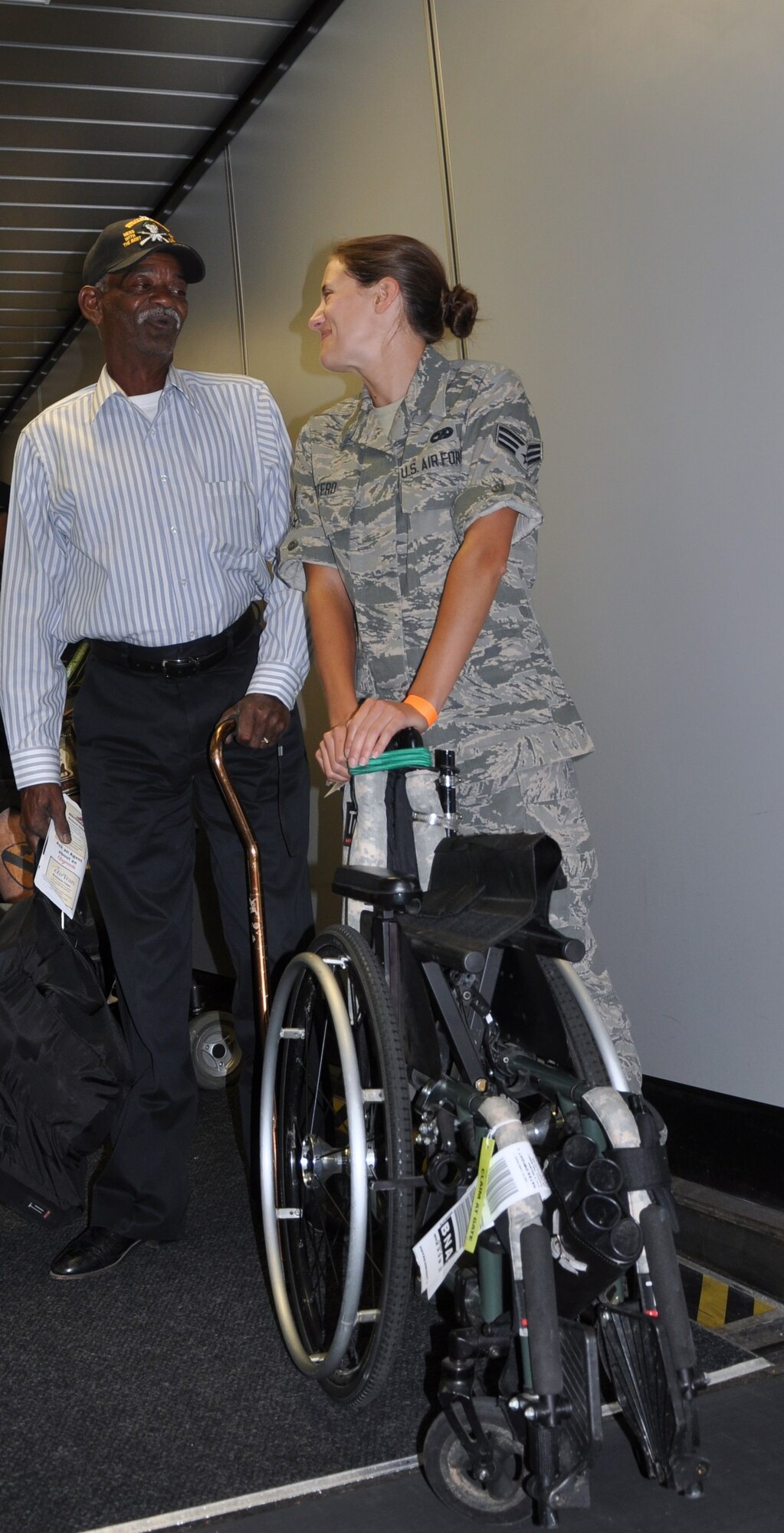 Dwight Hayes, an Army veteran with over 4,000 high altitude-low opening (HALO) jumps, discusses his performance in archery at the 34th National Veterans Wheelchair Games with Senior Airman Lauren Otero, 35th Aerial Port Squadron, before departing the Philadelphia International Airport, Aug. 18. Co-presented by the Department of Veterans Affairs and the Paralyzed Veterans of America, the NVWG is the world’s largest annual wheelchair multi-sport event in which more than 500 Veterans with spinal cord injury, amputations or other neurological disorders compete in 19 events. Some of the events include swimming, table tennis, weightlifting, archery, air guns, basketball, boccia, nineball, softball, quad rugby, bowling, handcycling, trapshooting, wheelchair slalom, power soccer, a motorized wheelchair rally, track and field. 