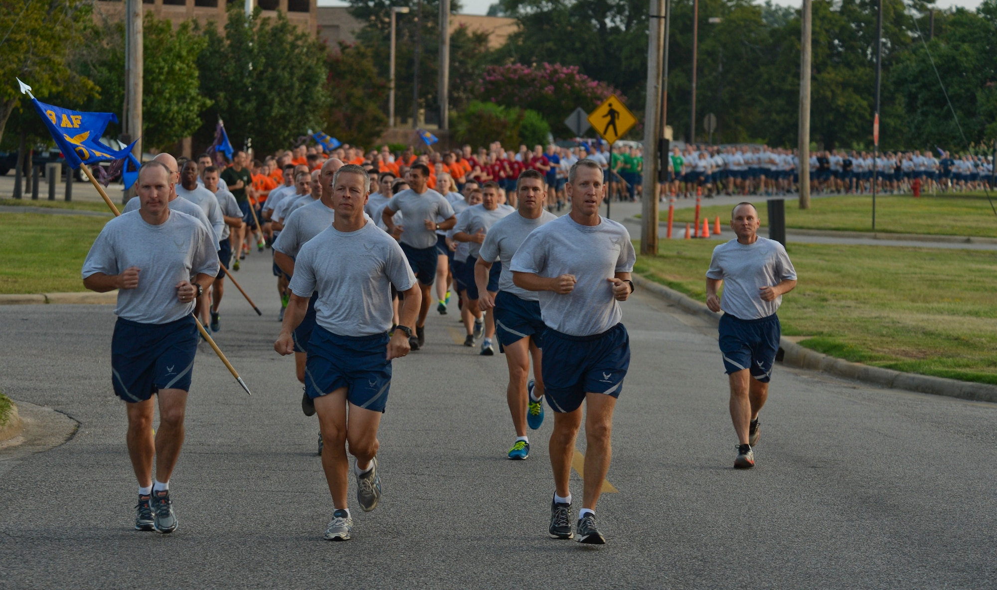 (From left) U.S. Air Force Col. Stephen Jost, 20th Fighter Wing commander, Col. Bill Jones, 20th FW vice commander, and Col. Scott Caine, Ninth Air Force vice commander, lead a formation run at Shaw Air Force Base, S.C., Aug. 22, 2014. The formation run was held to bring Team Shaw’s community together. (U.S. Air Force photo by Senior Airman Tabatha Zarrella/Released)
