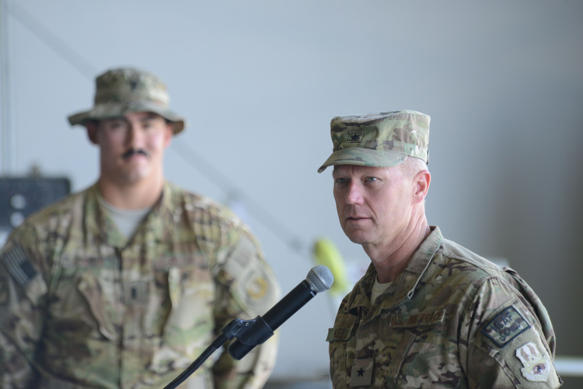 U.S. Air Force Brig. Gen. Mark D. Kelly, 455th Air Expeditionary Wing commander makes a few remarks regarding the mission of the 455th Expeditionary Operations Group before passing command of the group to Col. Jon C. Wilkinson during the 455 EOG Assumption of Command ceremony Aug. 26, 2014 at Bagram Airfield, Afghanistan. Wilkinson is now responsible for all expeditionary flying and aeromedical evacuation operations for the 455th Air Expeditionary Wing. (U.S. Air Force photo by Master Sgt. Cohen A. Young/Released)