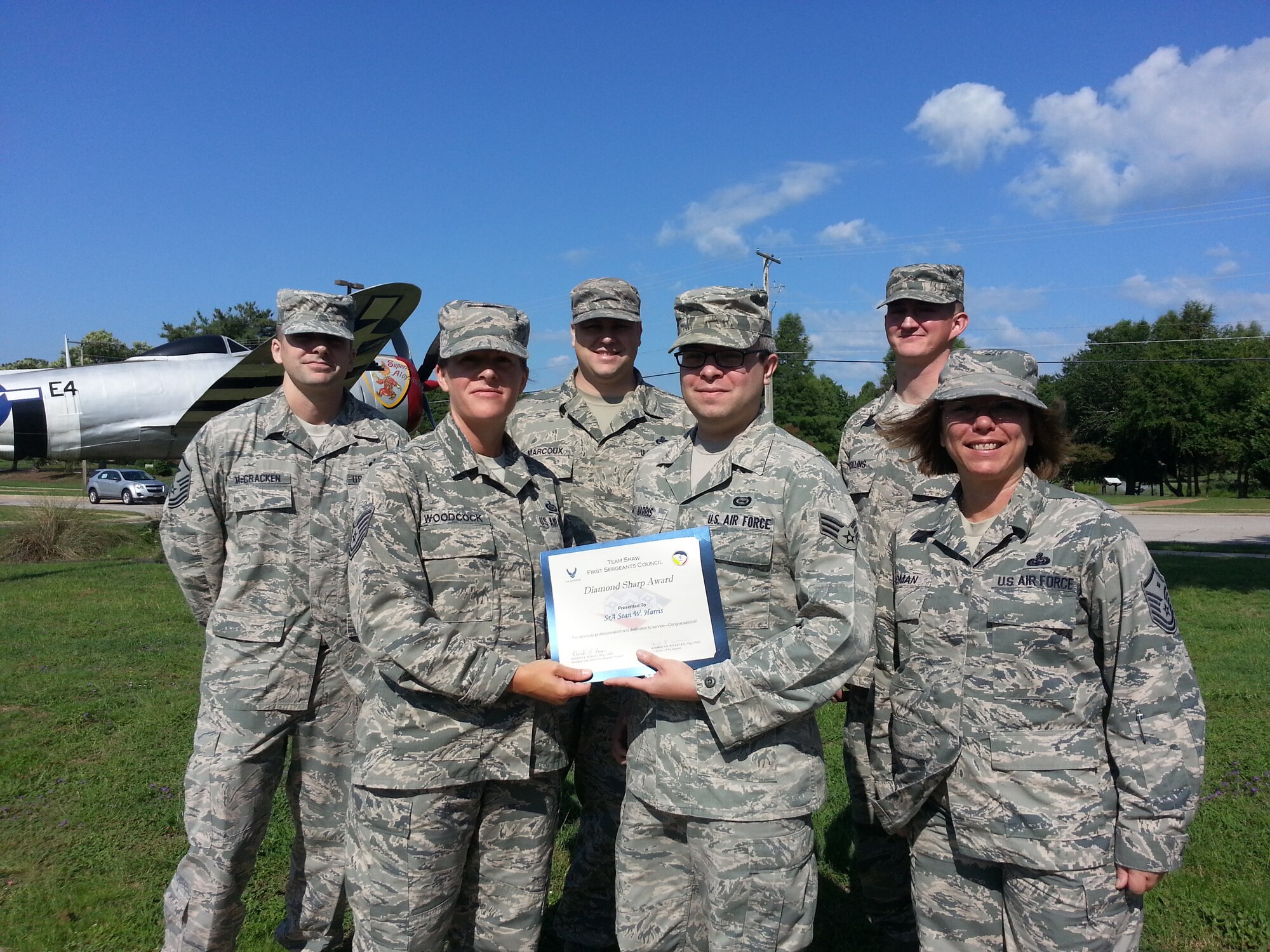 Senior Airman Sean Harris, 31th Intelligence Squadron Detachment 1 geospatial intelligence analyst, is recognized by members of the Shaw First Sergeants Council as "Diamond Sharp." Diamond Sharp, the First Sergeant Council’s program, aims to recognize two Airmen from across Shaw Air Force base monthly. (Courtesy photo)