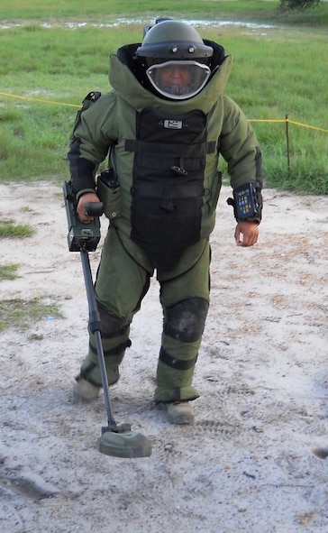An explosive ordnance disposal member scans the soil using a Vallan "Minehound" VMR2 metal detector during an operational utility event at the Naval Surface Warfare Center in Panama City, Fla. The detector uses ground penetrating radar to locate low to non-metallic mines that can elude traditional metal detectors. The Counter-Improvised Explosive Device Branch -- a Life Cycle Management Center team based out of Hanscom Air Force Base, Mass. -- was responsible for equipping 36 deployed Air Force EOD teams with the latest handheld detectors. (U.S. Air Force photo/Donald MacMillan) 
