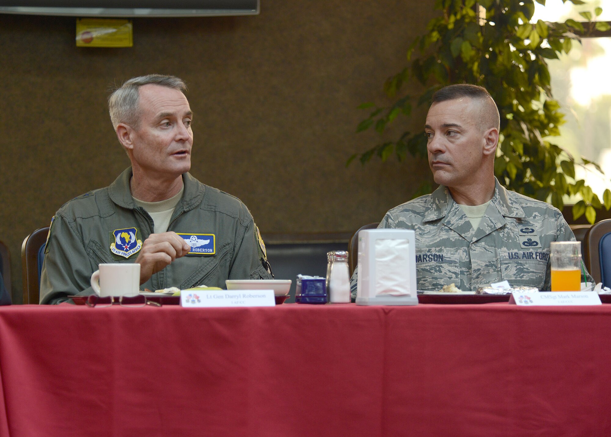 Lt. Gen. Darryl Roberson, 3rd Air Force commander, and Chief Master Sgt. Mark Marson, 3rd AF command chief, join Airmen during breakfast at the Sultan Inn dining facility Aug. 20, 2014, Incirlik Air Base, Turkey. The 3rd AF leadership spoke to Airmen about new changes with enlisted feedback forms known as the Airman Comprehensive Assessment, and described the benefits of the new changes. (U.S. Air Force photo by Staff Sgt. Veronica Pierce/Released)