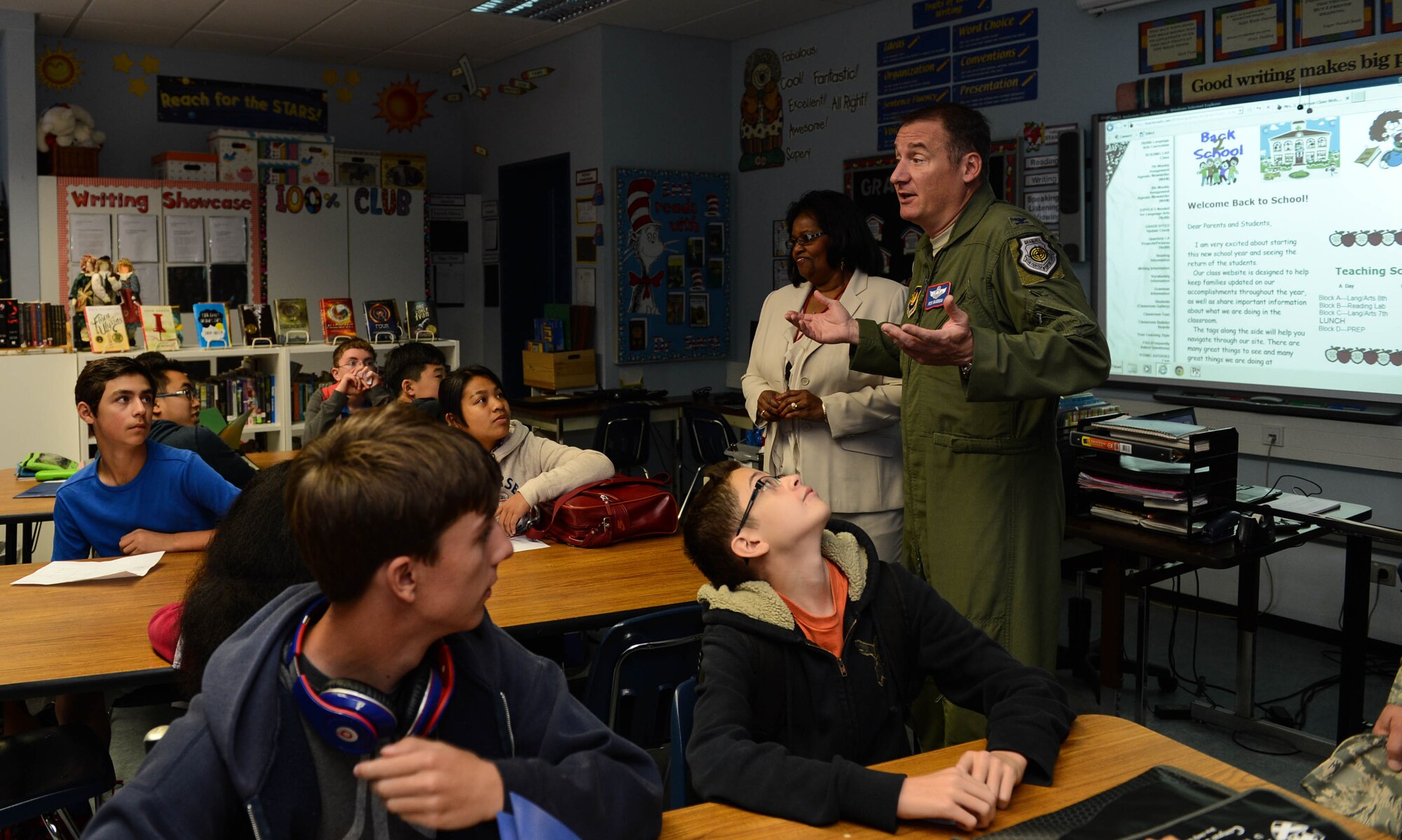 U.S. Air Force Col. Pete Bilodeau, 52nd Fighter Wing commander, talks with a class during the first day of school at Spangdahlem Air Base, Germany, Aug. 25, 2014. During a familiarization tour of the school, Bilodeau welcomed students and faculty while learning about the school's classes and programs. (U.S. Air Force photo by Airman 1st Class Kyle Gese/Released)