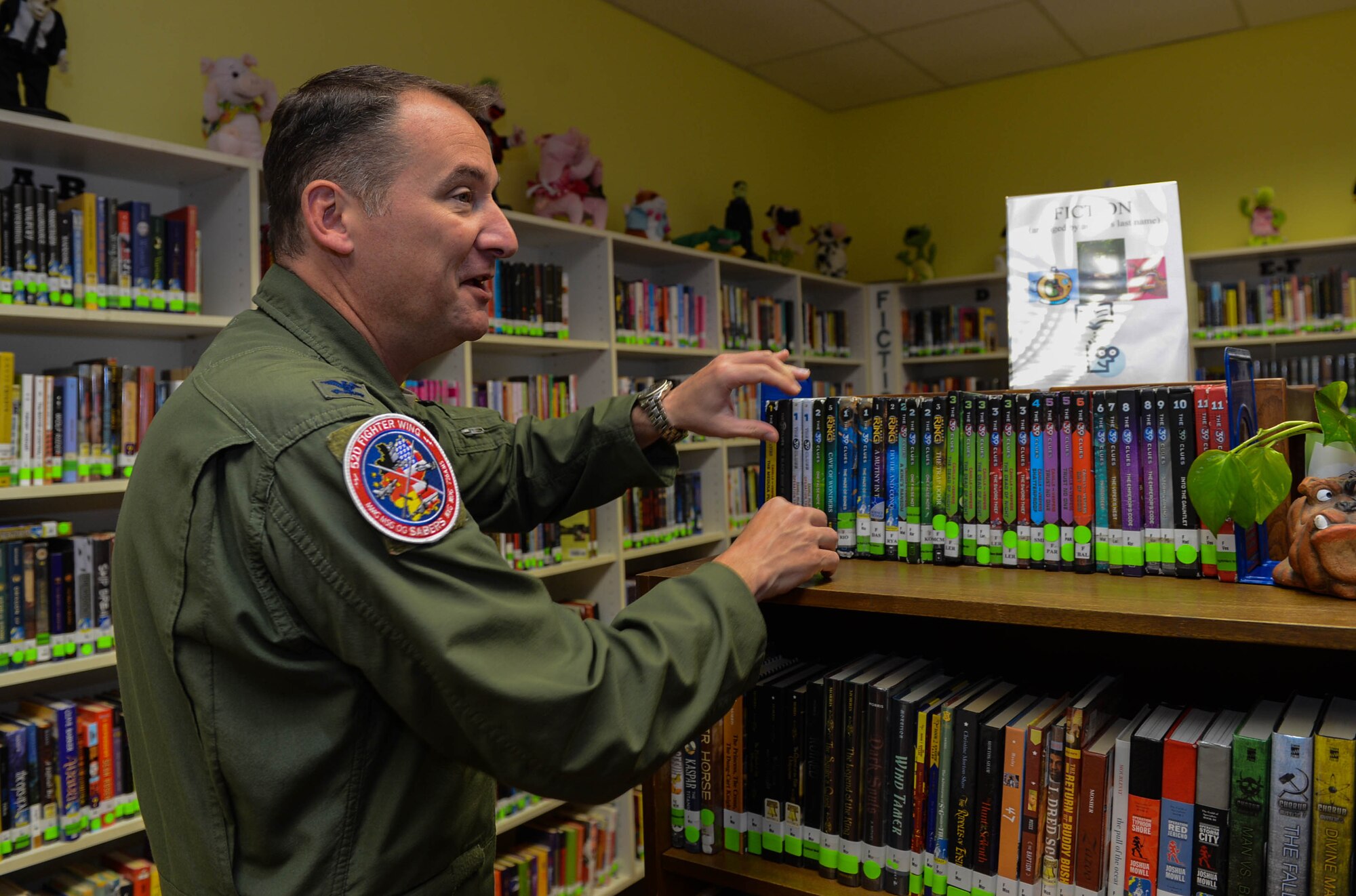 U.S. Air Force Col. Pete Bilodeau, 52nd Fighter Wing commander, visits the Spangdahlem Middle School library during the first day of school at Spangdahlem Air Base, Germany, Aug. 25, 2014. Bilodeau toured different classrooms to ask students if they were excited to begin the school year. (U.S. Air Force photo by Airman 1st Class Kyle Gese/Released)